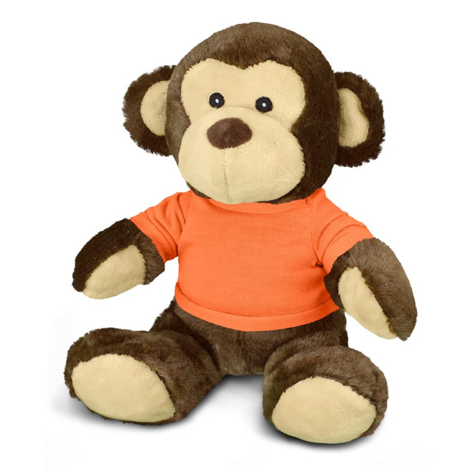 A brown and cream plush monkey toy wearing an orange shirt, featuring large ears and a friendly expression.
