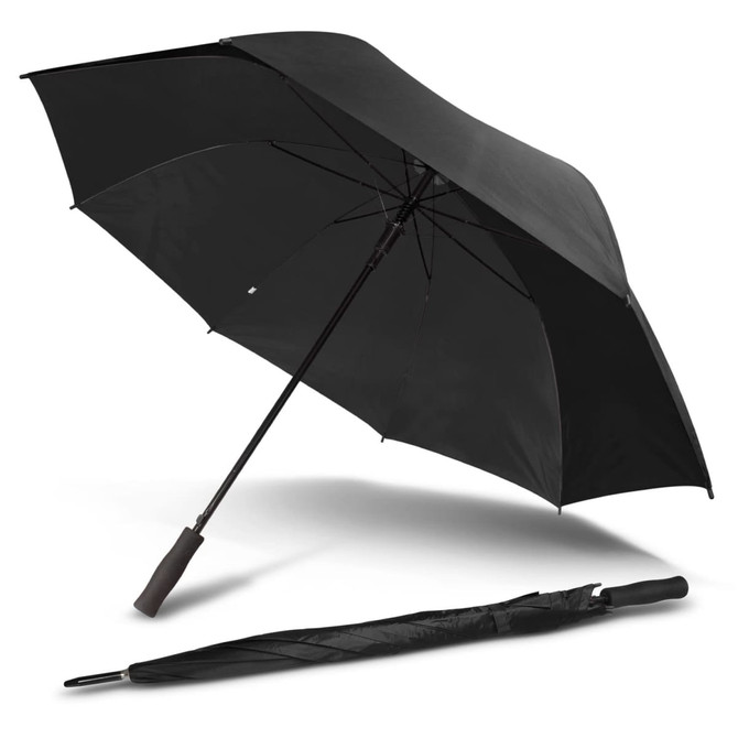 A black Pro-Am umbrella lies open, with a folded version beside it, featuring a simple design and a handle.