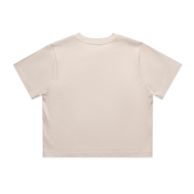 A light beige crop tee with short sleeves and a simple design. Features a logo on the back.