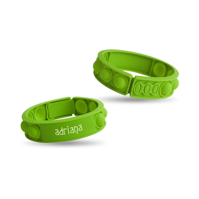 Two green silicone wristbands with raised dots, featuring one with a name printed on it and a logo.