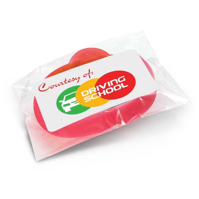 A red silicone wristband in packaging, featuring a logo. Ideal for exhibitions and events.