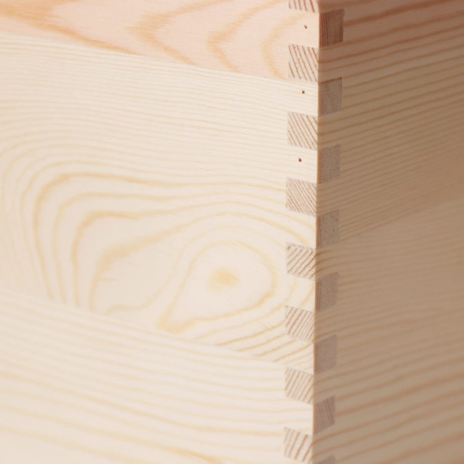 A large wooden storage box with a natural wood finish, featuring detailed dovetail joints.