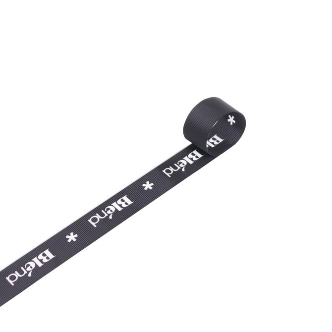A roll of 22mm width ribbed fabric ribbon in black, featuring a logo or branding along its length.