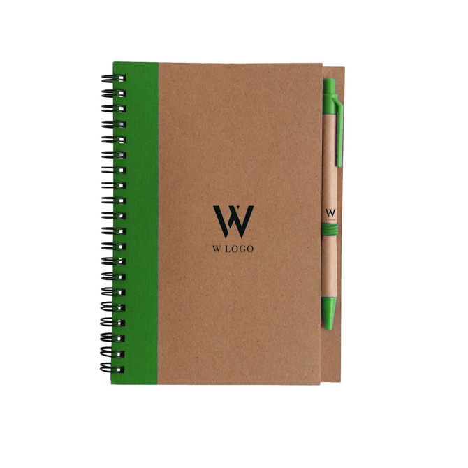 A kraft notebook with a green spine and a matching ballpoint pen. The notebook features a logo on the cover.