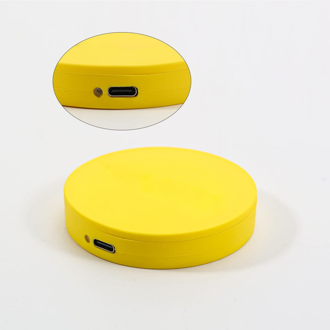A round, yellow custom-shaped PVC wireless charger with a USB-C port. Includes a close-up view.