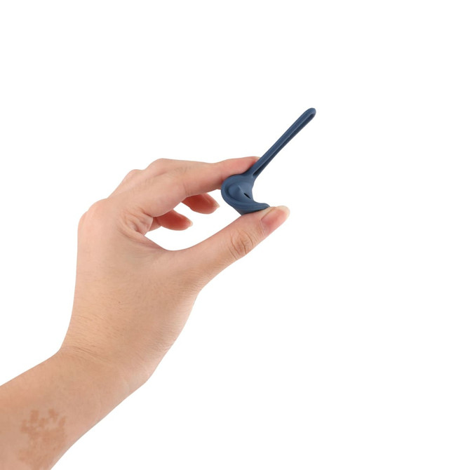 A hand holding a navy blue protective case for an Air Tag, featuring a sleek design and a loop for attachment.