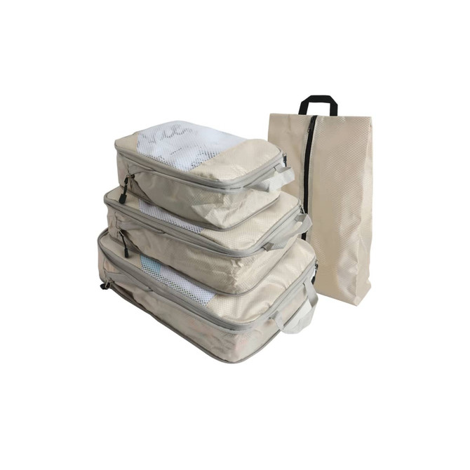 A set of four beige travel packing cubes with mesh tops and a matching carrying bag.