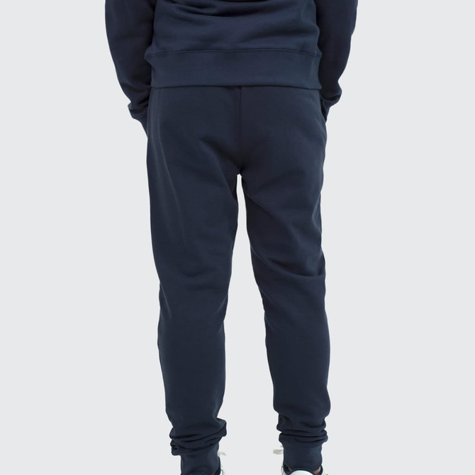 Unisex sweatpants in navy blue, featuring a fitted design and elastic cuffs. Includes a logo on the back.