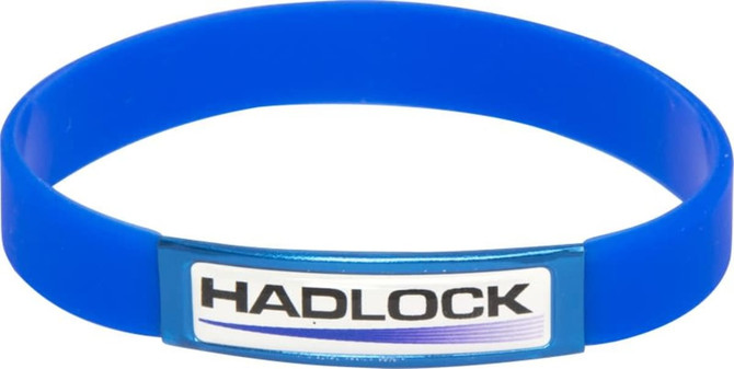 A blue silicon wristband featuring a central branding element. The wristband is flexible and smooth in texture.