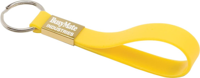 A yellow silicone keyring with a metal ring and a branded section. Designed for holding keys securely.