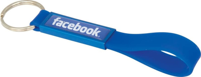 A blue silicone keyring with a dome-indented design and a metal keyring attachment.
