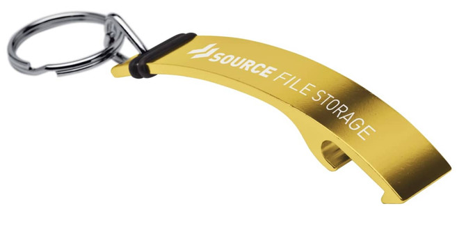 A drink bottle opener in gold metal, featuring a keyring attachment and branding.