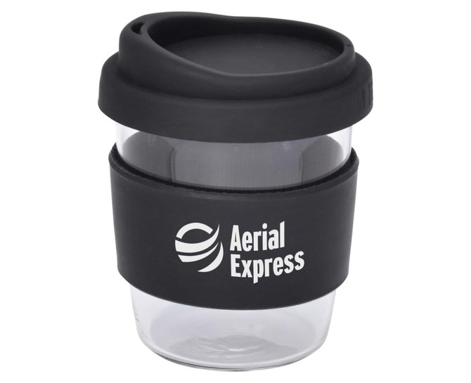 A reusable coffee cup in clear with a black silicone sleeve and a black lid, featuring a logo.