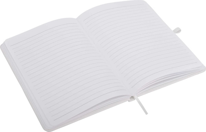 An open A5 notepad with lined pages, featuring a ribbon bookmark and a plain cover.