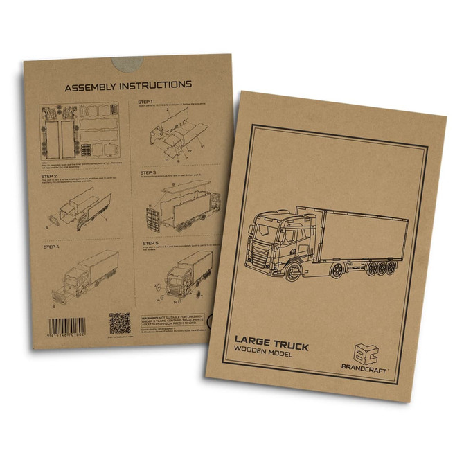 Assembly instructions for a large wooden truck model in a brown cardboard package, featuring a logo.
