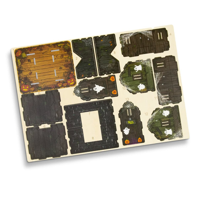 A wooden model kit featuring various parts in dark brown and green, with Halloween-themed designs and a logo.