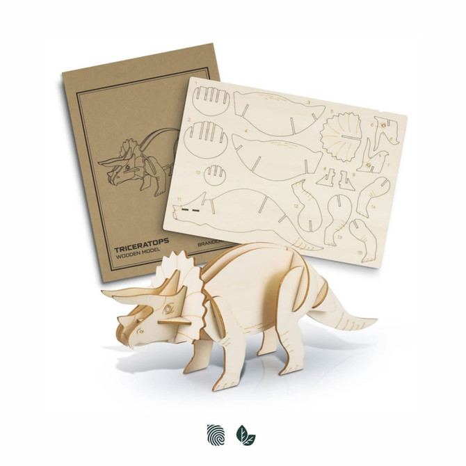 A wooden model of a triceratops in natural wood colour, alongside its parts sheet and packaging with a logo.