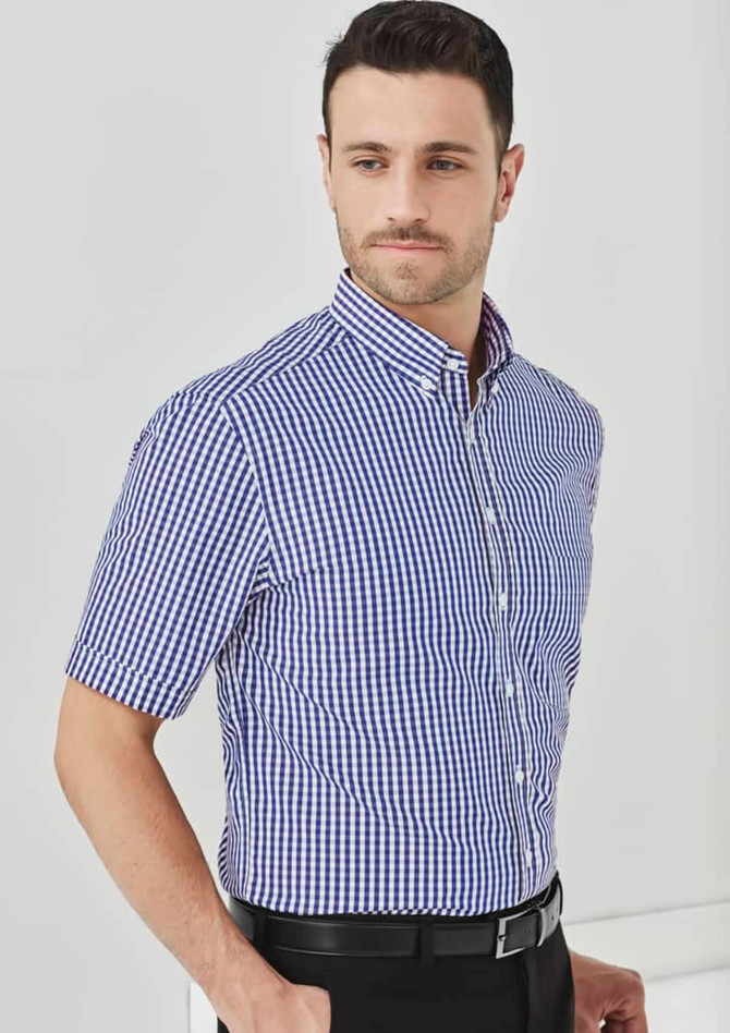 A short-sleeve button-up shirt in a blue and white checkered pattern, featuring a collar and a branded logo.