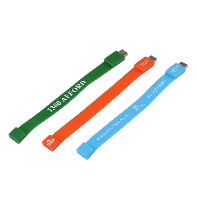 Three rectangular silicone wristband flash drives in green, orange, and blue, each featuring a logo and text.