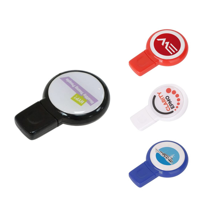 A set of round domed flash drives in black, red, white, and blue, each with a logo on the top.