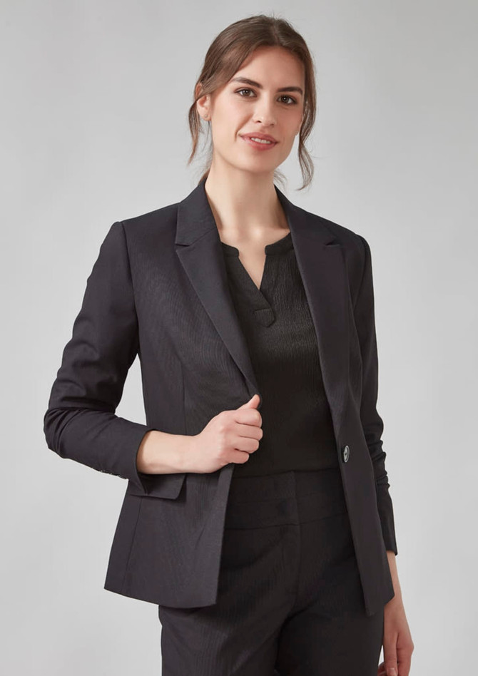 A women's black blazer with a tailored fit, featuring a single button and a notch lapel, worn over a top.