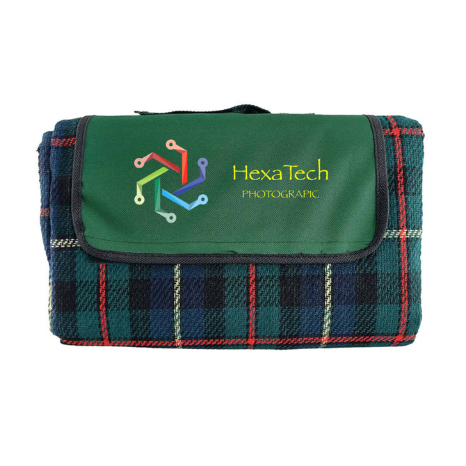 A folded picnic rug featuring a green and tartan check pattern, with a logo on the front.