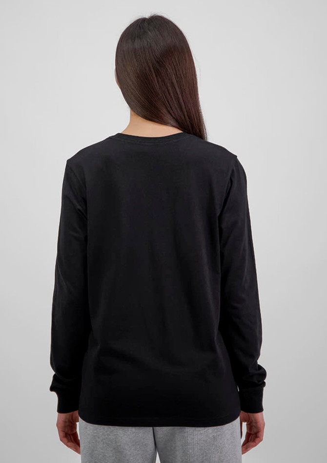 A black long sleeve women's tee, showing the back view and paired with light grey pants. The shirt has a logo.