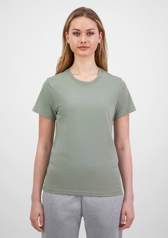 A short sleeve tee in a soft green colour, displayed on a model against a neutral background. It features a logo.