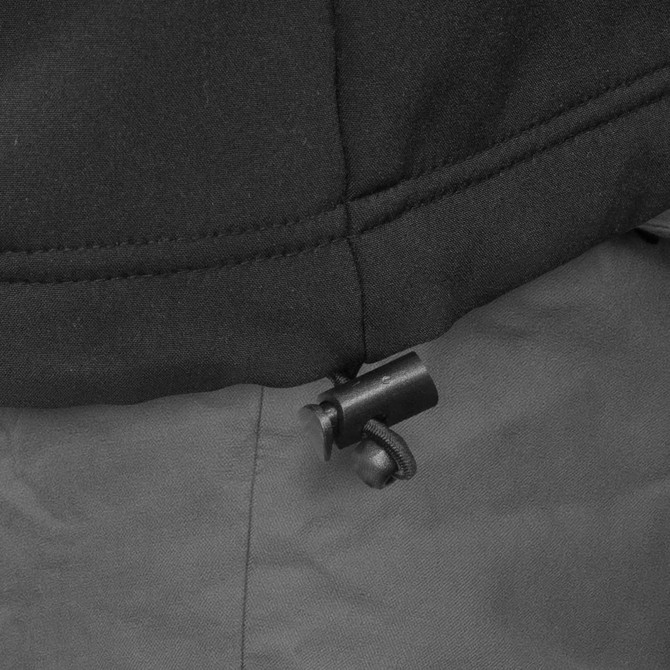 A black and grey vest featuring an adjustable toggle mechanism at the hem. It has a branding logo.