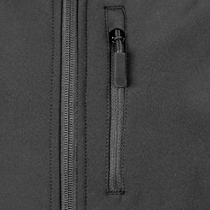 A black soft shell jacket featuring a zippered pocket and a smooth fabric finish. It has a logo on the front.