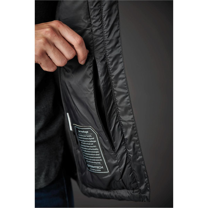 A black women's jacket with a pocket being opened, featuring a tag visible inside.