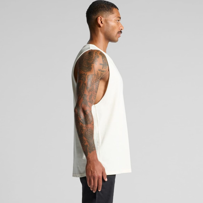 A light-coloured singlet tank top with a loose fit, featuring side cutouts and a logo.