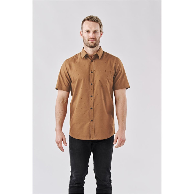A short-sleeved button-up shirt in a brown hue, featuring a subtle pattern and a logo.