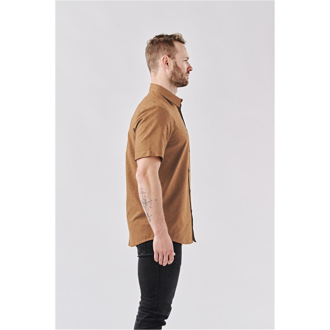 A men's short-sleeve button-up shirt in brown, featuring a subtle pattern, displayed on a model in profile.