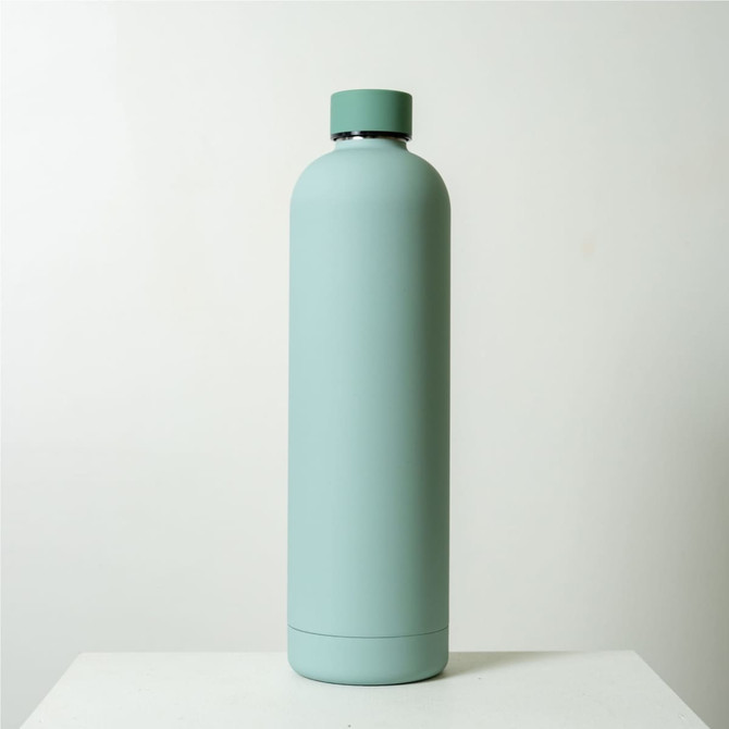 A drink bottle in a soft mint green colour, featuring a sleek design and a base logo.