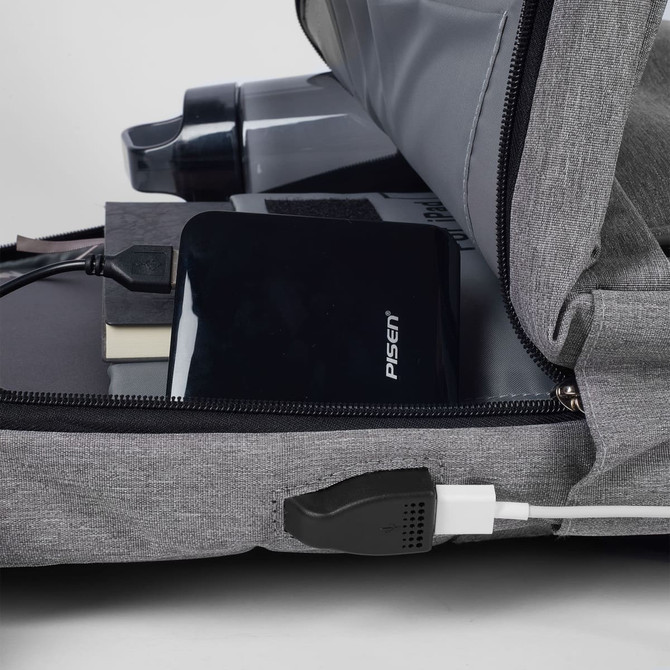 A grey Techpac laptop backpack with a drink bottle, power bank, and books visible inside. It features a logo.