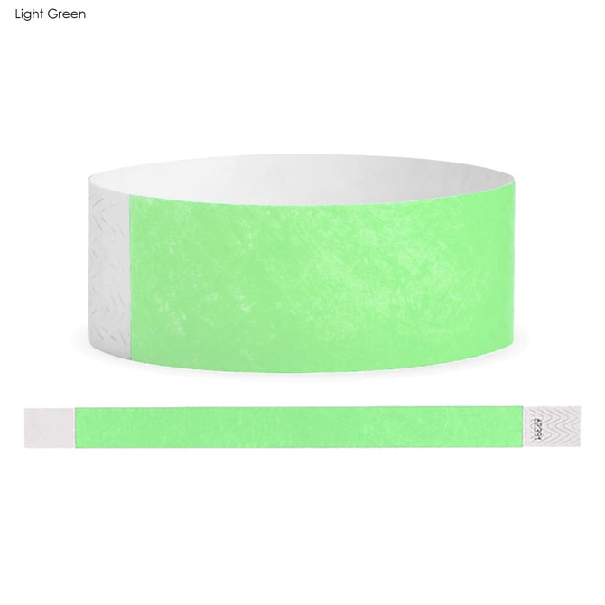 A light green Tyvek adult wristband displayed flat, featuring a textured design and a logo.