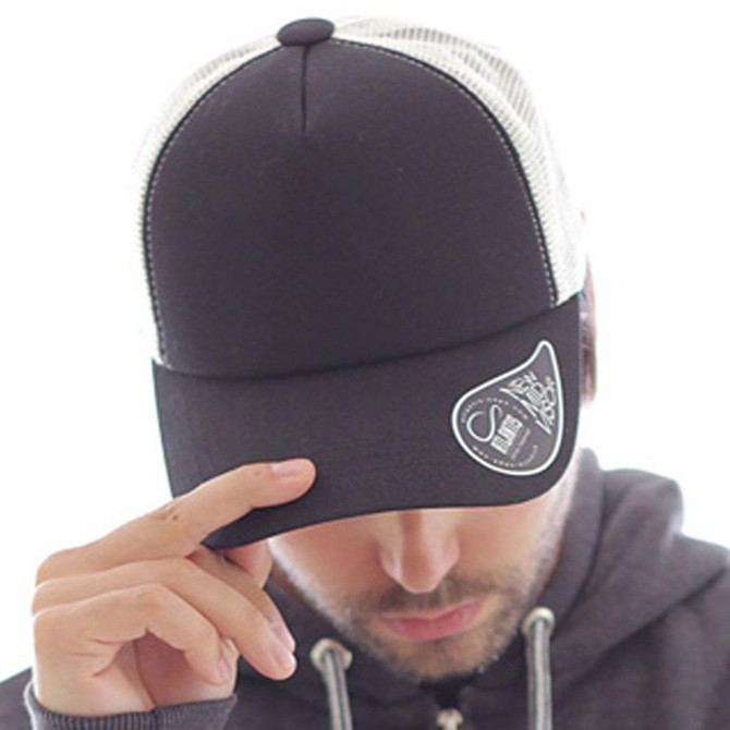 A black trucker cap with a white mesh rear, featuring a branded patch on the front.