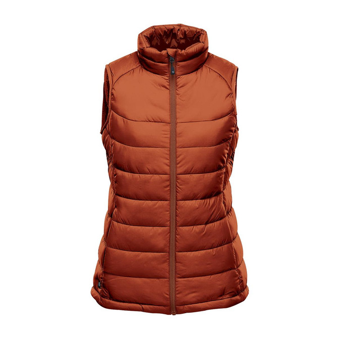 A women's thermal vest in a warm orange hue with a high collar and quilted design. It features a centre zip and has a logo.