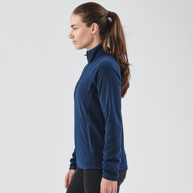 A navy women's fleece jumper with a quarter zip and a side pocket, featuring a fitted silhouette and long sleeves.