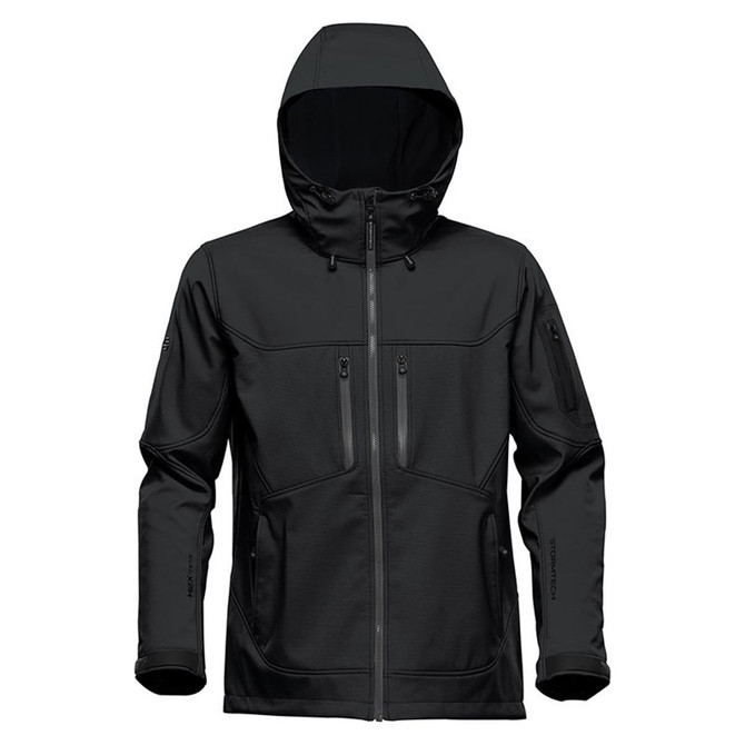 A black softshell jacket with a hood, featuring multiple zippered pockets and a logo on the sleeve.