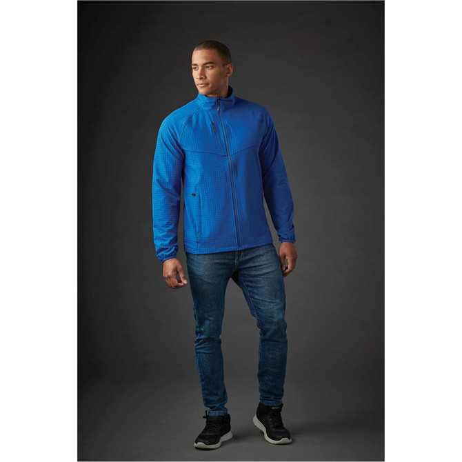 A blue men's jacket with a textured pattern, featuring a zip closure and a collar, alongside fitted jeans and sneakers.