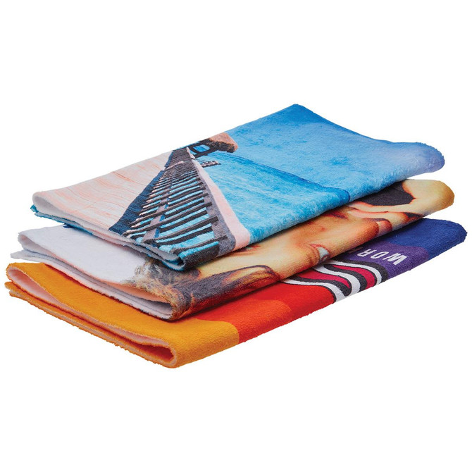 Three folded sublimation sports towels featuring vibrant designs in shades of blue, orange, and multi-colour, with branding visible.