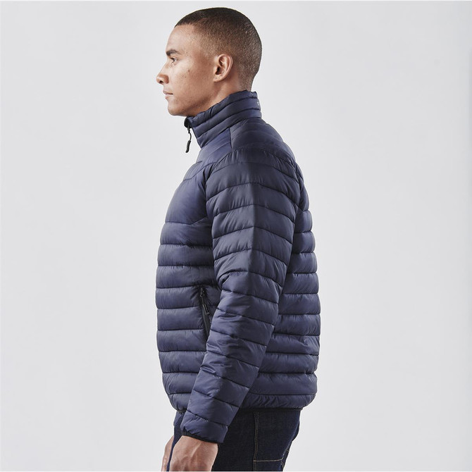 A navy puffer jacket with a high collar and side zip pockets, displayed on a male model.
