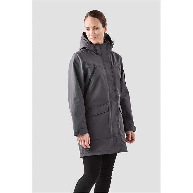 A women's 5-in-1 system jacket in grey, featuring a hood and multiple pockets. The model stands against a light background.