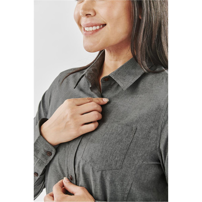 A women's button-up shirt in dark grey featuring a chest pocket and a collar. Includes a subtle logo.
