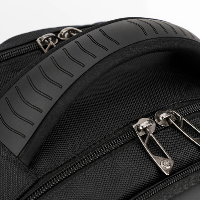 A black backpack featuring a textured handle and double zippers. It has a sleek, durable design.