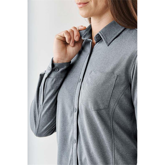 A grey button-up long sleeve shirt for women, featuring a collar and a chest pocket, with a logo visible.