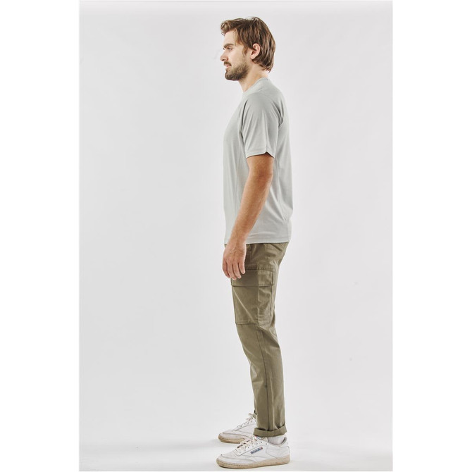 A light grey men's t-shirt displayed on a model, featuring a simple design and a logo.