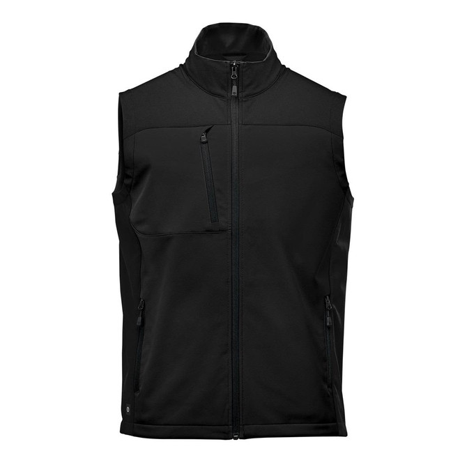 A black softshell vest with a high collar, zippered front, and multiple pockets. Features a logo on the garment.